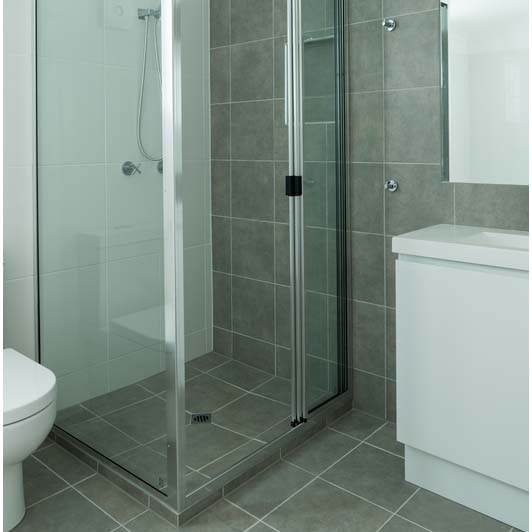 newly installed shower with grey tiles